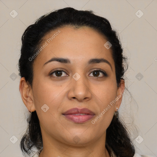 Joyful latino adult female with medium  brown hair and brown eyes