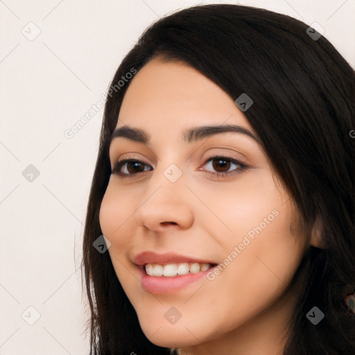 Joyful white young-adult female with long  black hair and brown eyes