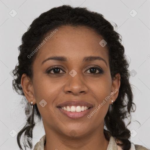 Joyful black young-adult female with long  brown hair and brown eyes