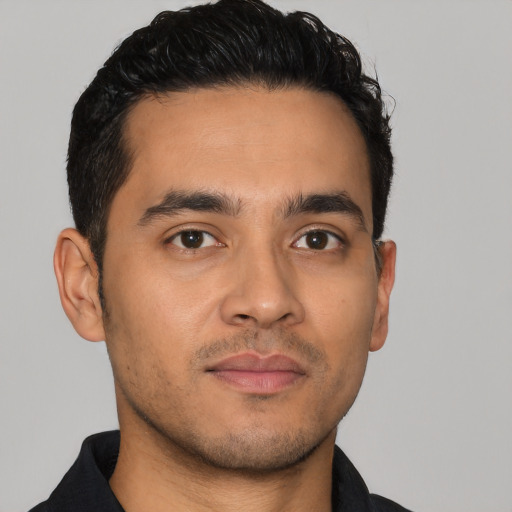 Neutral latino young-adult male with short  black hair and brown eyes