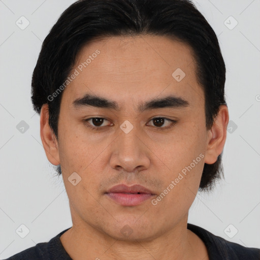 Joyful asian young-adult male with short  black hair and brown eyes