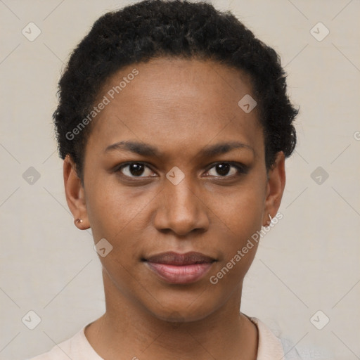 Joyful black young-adult female with short  black hair and brown eyes