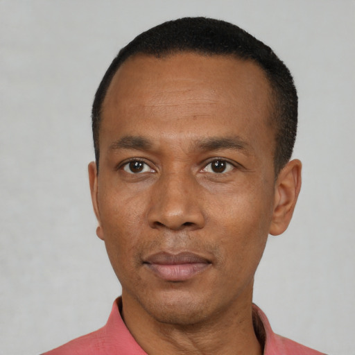 Neutral black adult male with short  black hair and brown eyes