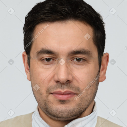 Joyful white adult male with short  brown hair and brown eyes