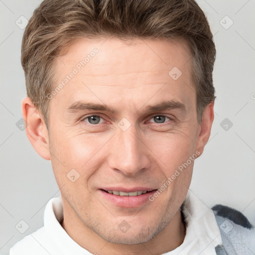 Joyful white adult male with short  brown hair and grey eyes