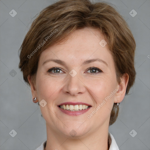 Joyful white adult female with medium  brown hair and grey eyes