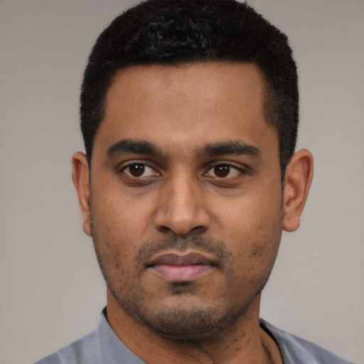 Neutral black young-adult male with short  black hair and brown eyes