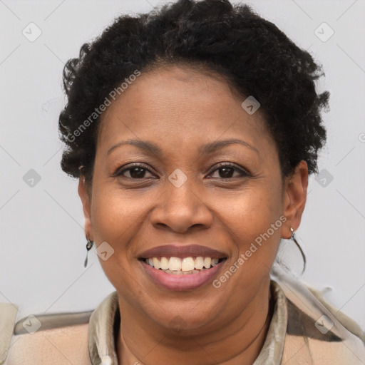 Joyful black adult female with short  brown hair and brown eyes