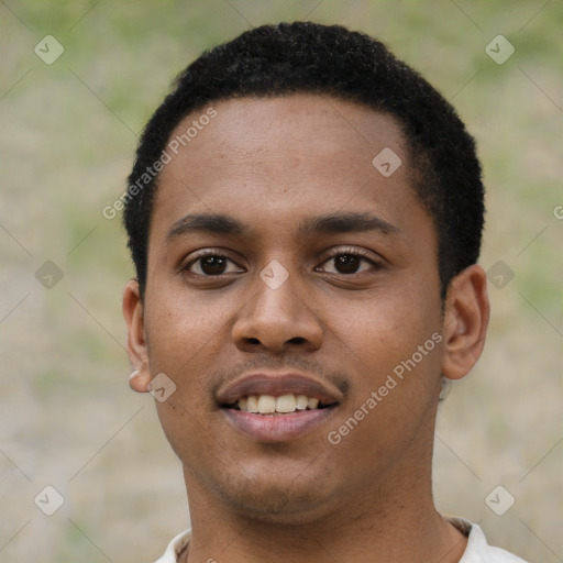 Joyful black young-adult male with short  black hair and brown eyes