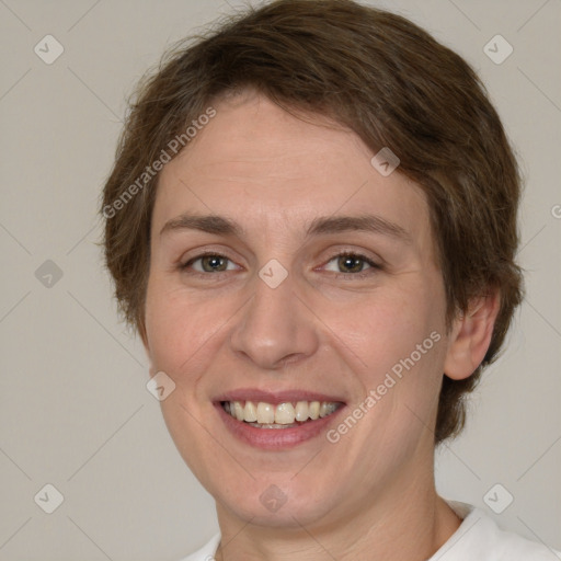 Joyful white adult female with short  brown hair and brown eyes