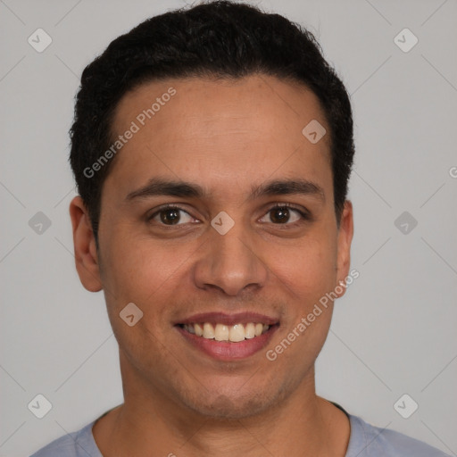 Joyful latino young-adult male with short  brown hair and brown eyes