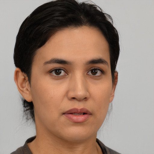 Neutral latino young-adult female with medium  brown hair and brown eyes