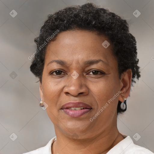 Joyful black adult female with short  brown hair and brown eyes