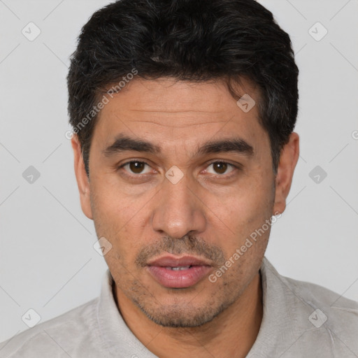Joyful white adult male with short  black hair and brown eyes