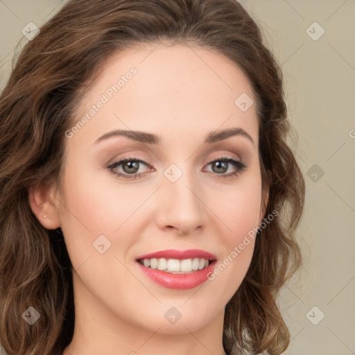 Joyful white young-adult female with long  brown hair and green eyes