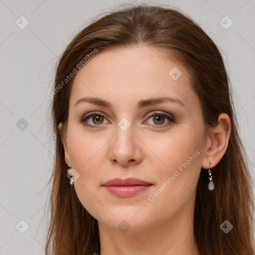 Joyful white young-adult female with long  brown hair and green eyes