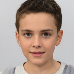 Joyful white child male with short  brown hair and brown eyes