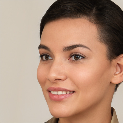 Joyful white young-adult female with short  brown hair and brown eyes