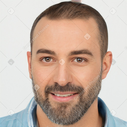 Joyful white young-adult male with short  black hair and brown eyes