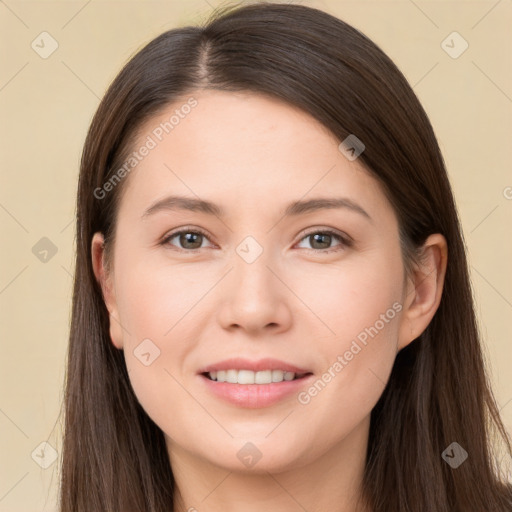 Joyful white young-adult female with long  brown hair and brown eyes