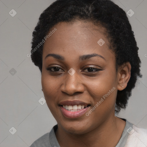 Joyful black young-adult female with short  black hair and brown eyes