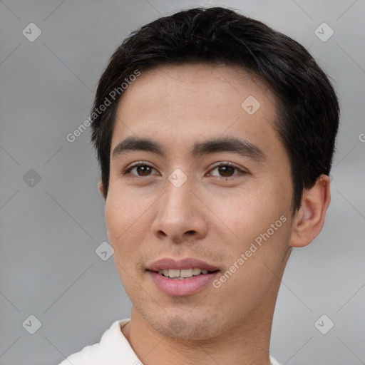 Joyful asian young-adult male with short  brown hair and brown eyes