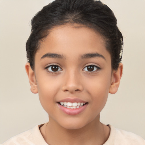 Joyful white child female with short  brown hair and brown eyes