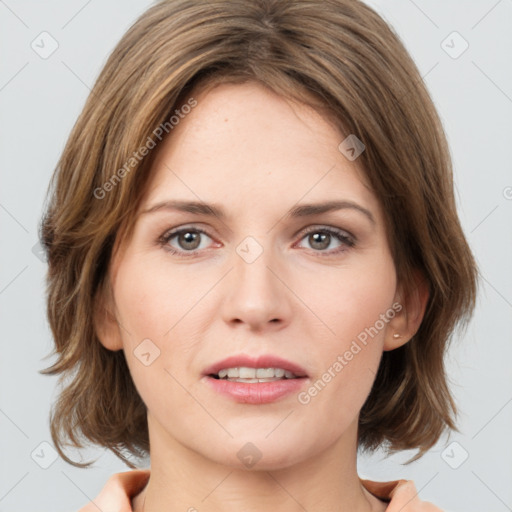 Joyful white young-adult female with medium  brown hair and green eyes