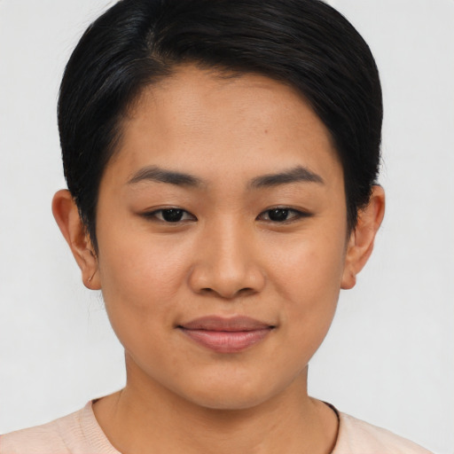 Joyful asian young-adult female with short  black hair and brown eyes
