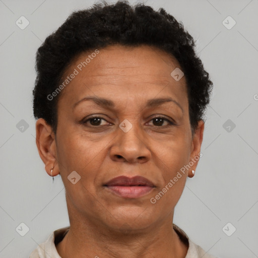 Joyful black adult female with short  brown hair and brown eyes