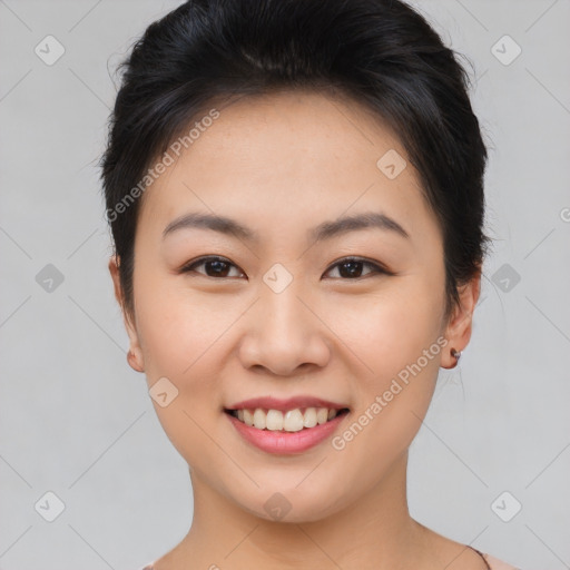 Joyful asian young-adult female with short  brown hair and brown eyes