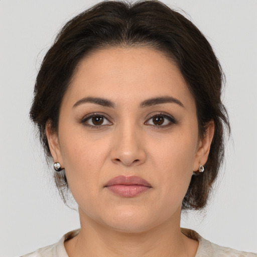 Joyful white young-adult female with medium  brown hair and brown eyes