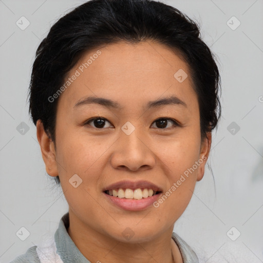 Joyful asian young-adult female with medium  black hair and brown eyes