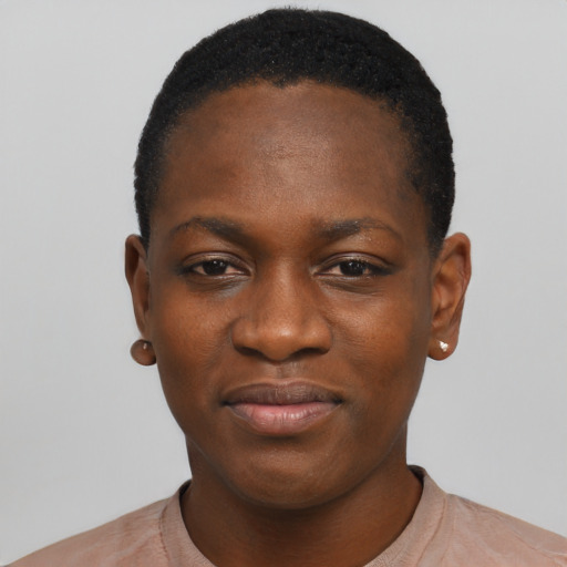 Joyful black young-adult female with short  black hair and brown eyes
