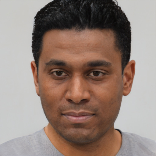 Neutral black young-adult male with short  black hair and brown eyes