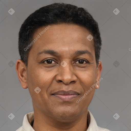 Joyful latino adult male with short  brown hair and brown eyes