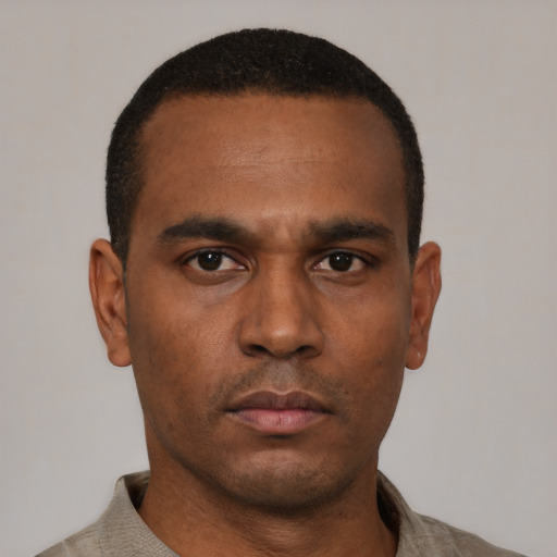 Neutral black young-adult male with short  black hair and brown eyes