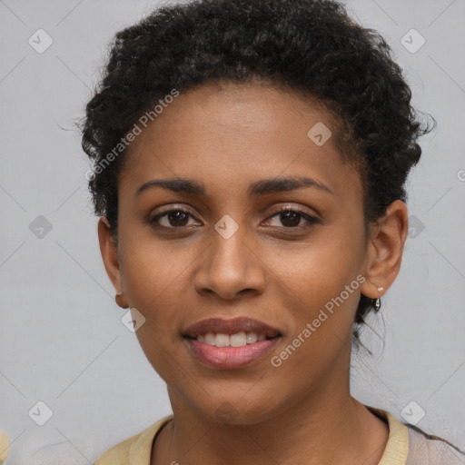 Joyful black young-adult female with short  brown hair and brown eyes