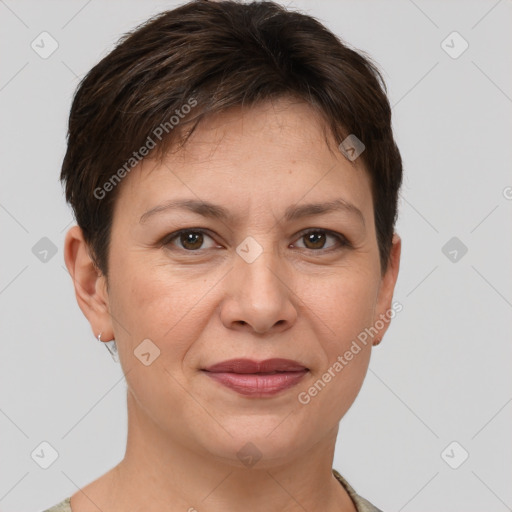 Joyful white adult female with short  brown hair and grey eyes