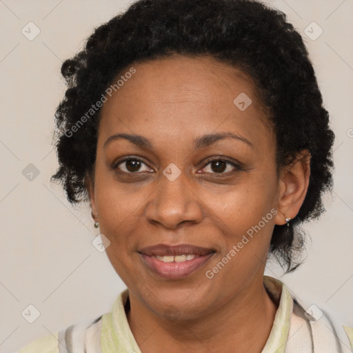 Joyful black adult female with short  brown hair and brown eyes