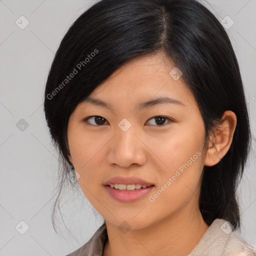 Joyful asian young-adult female with medium  black hair and brown eyes