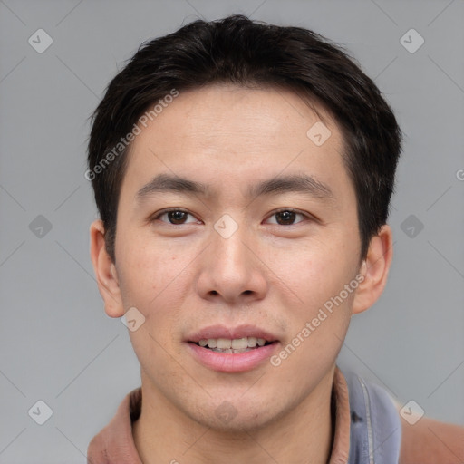 Joyful asian young-adult male with short  brown hair and brown eyes