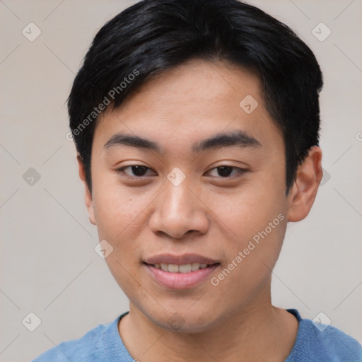 Joyful asian young-adult male with short  black hair and brown eyes