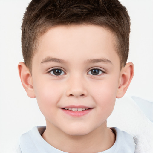 Joyful white child male with short  brown hair and brown eyes