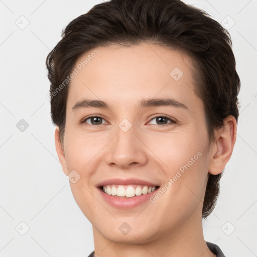 Joyful white young-adult female with short  brown hair and brown eyes