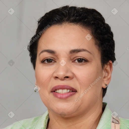 Joyful latino adult female with short  brown hair and brown eyes