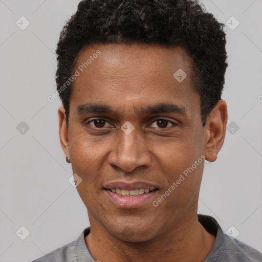 Joyful black young-adult male with short  black hair and brown eyes