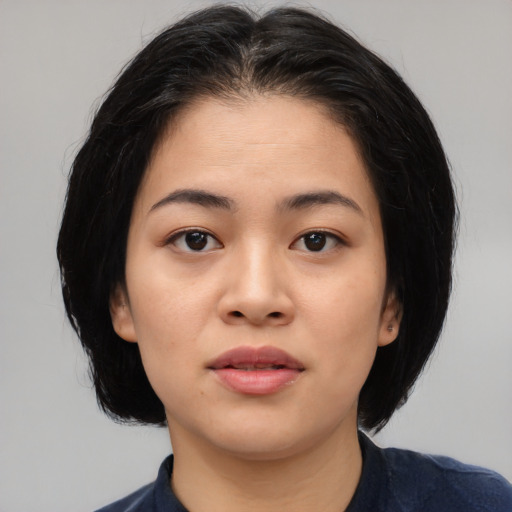 Neutral asian young-adult female with medium  black hair and brown eyes