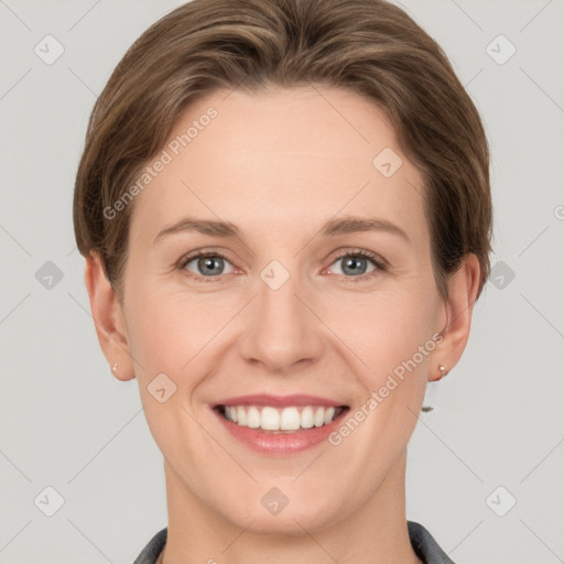 Joyful white young-adult female with short  brown hair and grey eyes