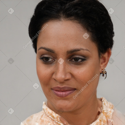 Joyful latino young-adult female with medium  brown hair and brown eyes